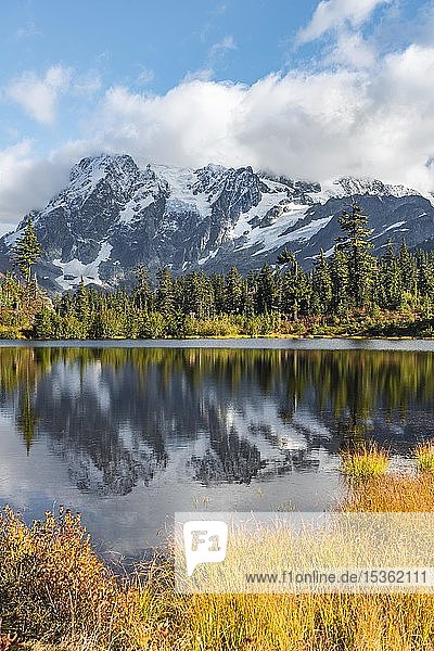 Mount Mt. Shuksan with reflection in Picture Lake  forest in front of glacier with snow  ice and rocks  Mount Baker-Snoqualmie National Forest  Washington  USA  North America