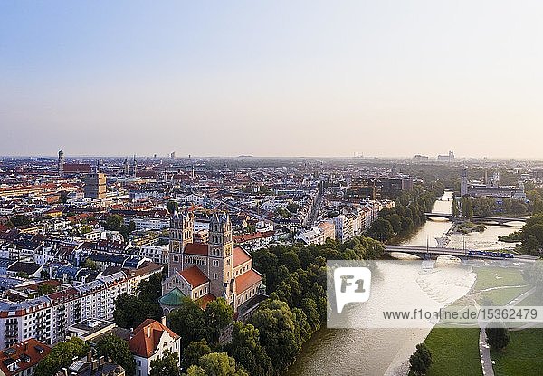 City view with Maximilianskirche and Reichenbach bridge over Isar at sunrise  Isarvorstadt  aerial view  Munich  Upper Bavaria  Bavaria  Germany  Europe