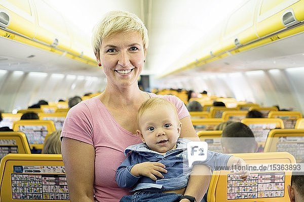 Mother with her six months old baby boy in the airplane  Spain  Europe