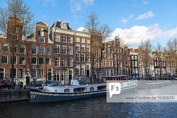 Canal with boats and historic houses  Amsterdam  North Holland  Holland  Netherlands