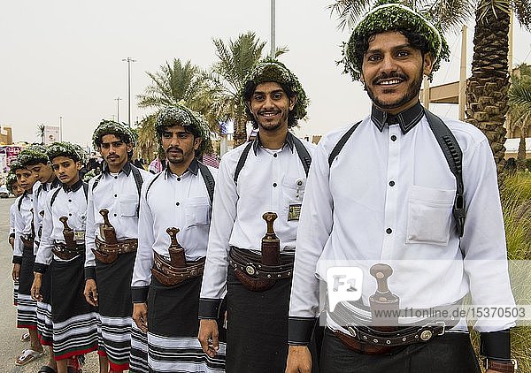 Traditional dressed men with with crooked dagger  Al Janadriyah Festival  Riad  Saudi Arabia  Asia
