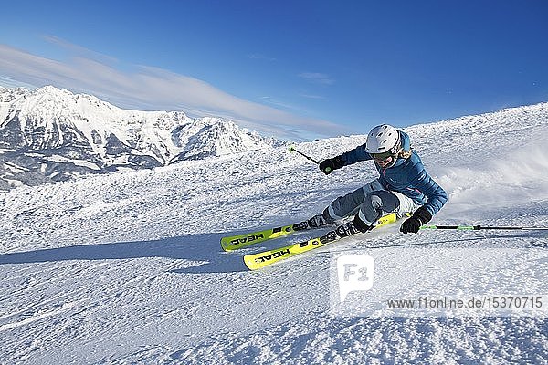 Young female skier with sporty style of skiing at the descent from the Hohe Salve  Hopfgarten  Tyrol  Austria  Europe