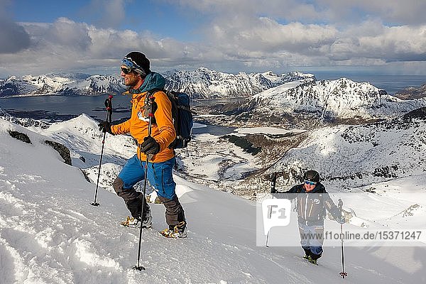 Mountaineers climbing Stortinden in winter  Svolvaer  Austvågøy  Lofoten  Norway  Europe