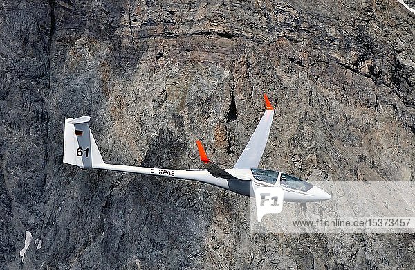 Glider of type ASH25 in front of a rock face in the mountains  Haute Alpes  France  Europe