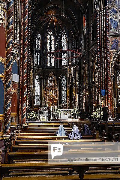 Nuns pray in the Basilica of St Mary  Kevelaer  Lower Rhine  North Rhine-Westphalia  Germany  Europe