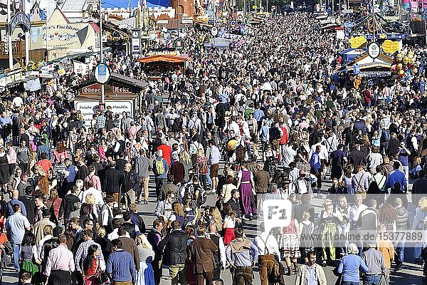 Crowds of people  crowded between the stalls  Oktoberfest  Munich  Upper Bavaria  Bavaria  Germany  Europe