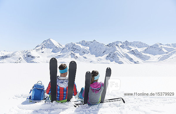 Couple of ski tourers having a break in the mountains Kuehtai Tyrol Austria