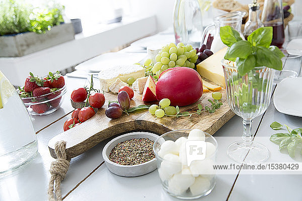 Laid table with fruit and cheese