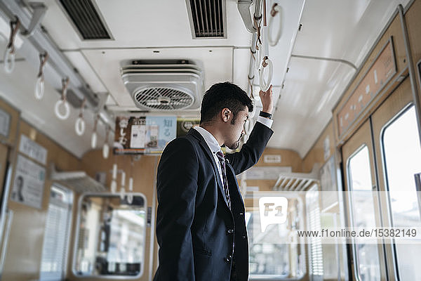 Young businessman on a train
