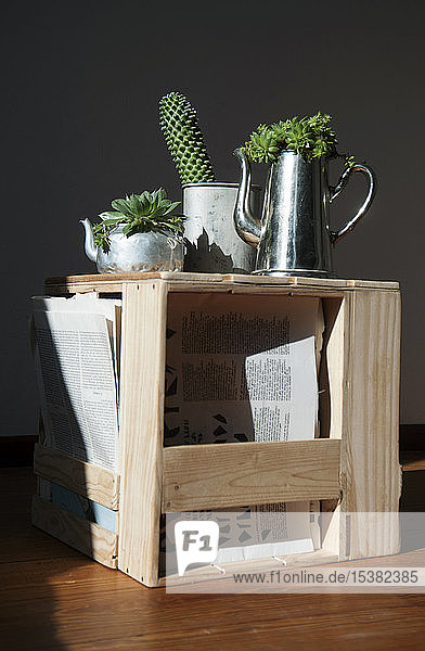 Stool made from old wine and apple crates  succulents in metal