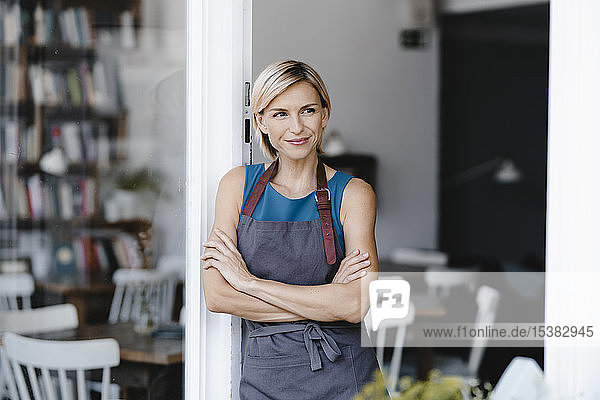 Business owner standing in front of her coffee shop