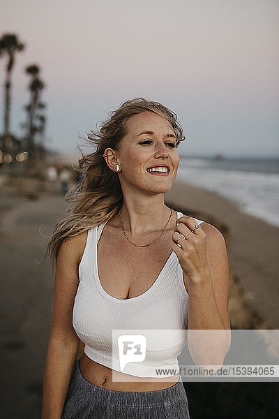 Happy young woman on the beach  Huntington Beach  California  USA