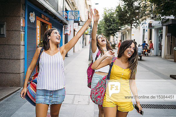 Three carefree female friends in the city