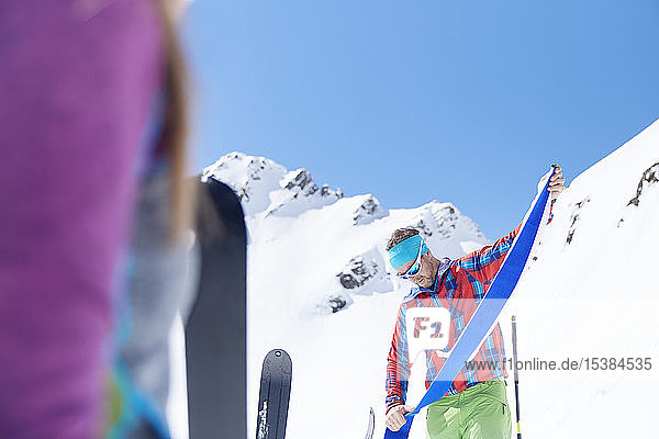 Ski tourer removing pelt from ski in the mountains Kuehtai Tyrol Austria