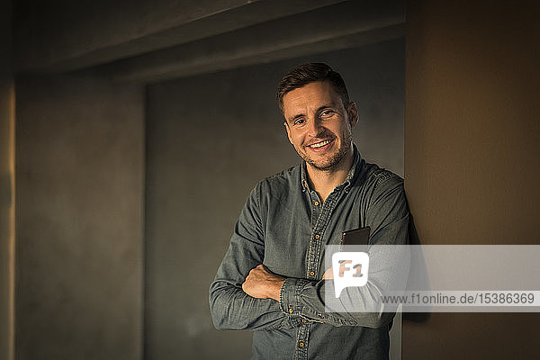 Portrait of a confident young businessman in his office