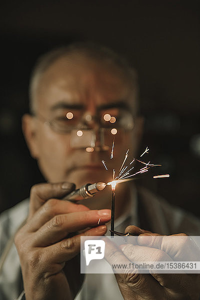 Artisan soldering precious metal  portrait