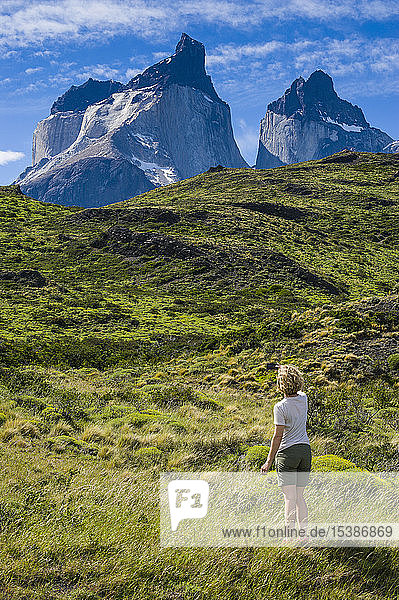 Chile  Patagonia  woman standing on medow in Torres del Paine National Park