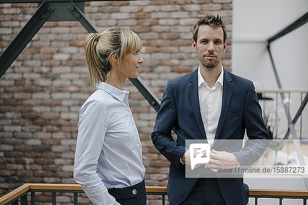 Businesswoman looking admiring at colleague