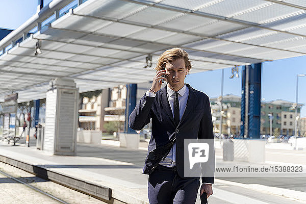 Italy  Florence  young businessman on smartphone outdoor