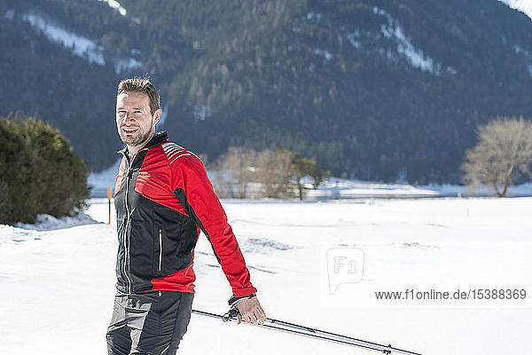 Austria  Tyrol  Achensee  portrait of smiling man doing cross country skiing