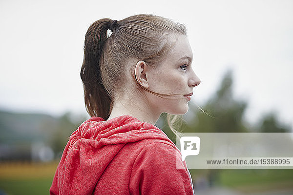 Profile of teenage girl with pigtail