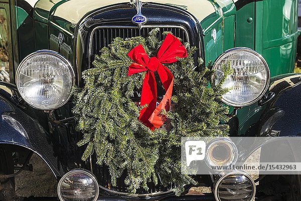USA New England Massachusetts Nantucket Island Nantucket Town old bus with Christmas wreath.