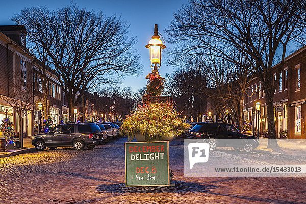 USA New England Massachusetts Nantucket Island Nantucket Town Main Street Christmas decaration dusk.