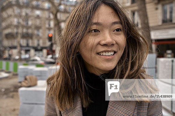Young Asian woman at street in city  in Paris  France.