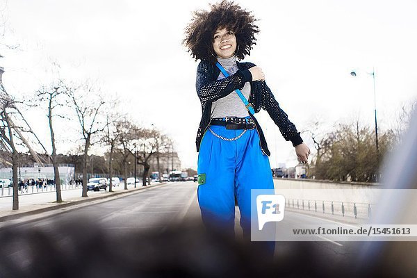 Young smiling woman at street in Paris France