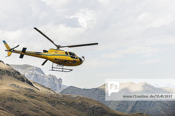 Helicopter flying in Pyrenees national Park (Hautes-Pyrénées Department Nouvelle-Aquitaine Region France)