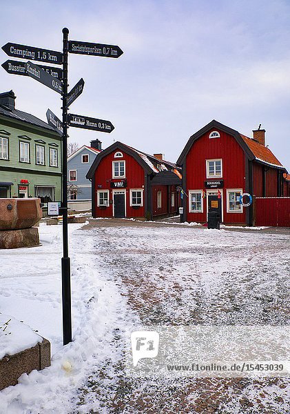 Businesses in traditional falun red timber buildings  Lilla Torget  Norrtalje  Stockholm County  Sweden  Scandinavia