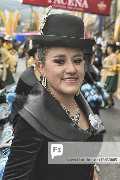 Cholita with the latest fashion at the Gran Poder Festival, La Paz, Bolivia.