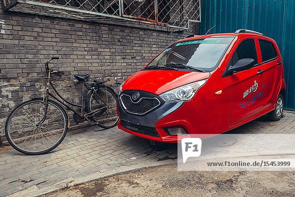 Three-wheeled car in traditional hutong residential area in Dongcheng district of Beijing China.