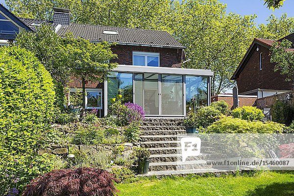 Oberhausen Sterkrade residential house with winter garden single-family home row house garden side flower garden rock garden rockery outside staircase perron natural stone stairs D-Oberhausen D-Oberhausen-Sterkrade Lower Rhine Ruhr area North Rhine-Westphalia NRW *** Local Caption ***.