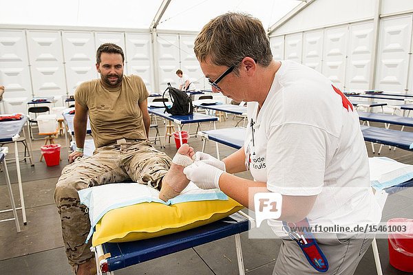 Nijmegen Breukelen Netherlands. Red Cross medical staff taking care of blisters and injuries at the first aid post during the Nijmegen Four Day March 2017.