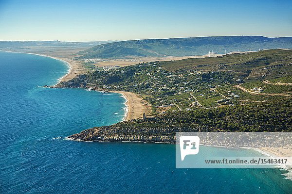 Alemanes beach. In the foreground Camarinal Lighthouse. Zahara de los Atunes. Barbate. Atlantic ocean. Cadiz province. Andalucia. Spain.