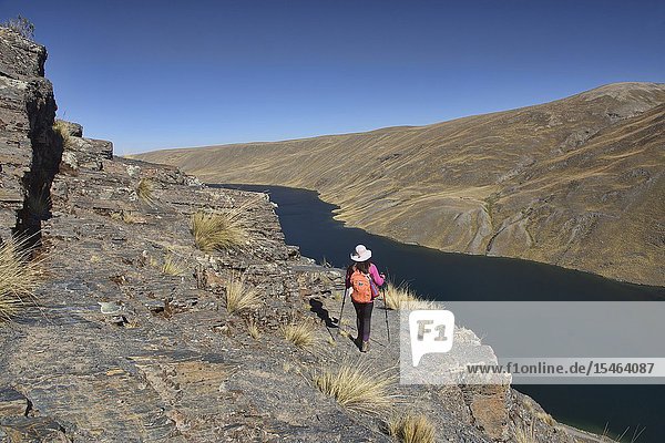 Trekking above Lake Khara Khota (Q'ara Quta) along the Cordillera Real Traverse Bolivia.