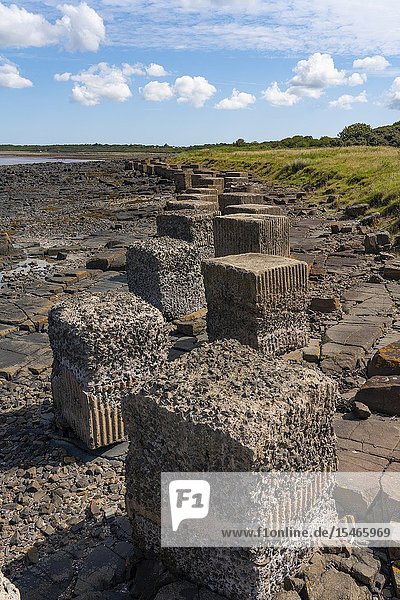 Aerial view of Second World War era anti-tank blocks on shore at Gosford Sands at Longiddry in East Lothian Scotland UK.