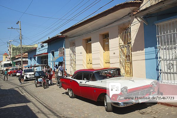 Local people in front of the colonial houses at the town center Trinidad Sancti Spiritu Province Cuba West Indies Central America