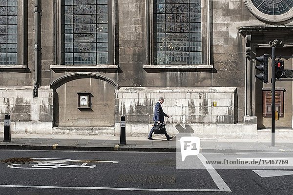 City of London England-city worker running late for work in the financial district.