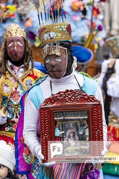 Procession of the Virgen del Carmen of Paucartambo (Cusco) characters and typical costumes. Peru South America.