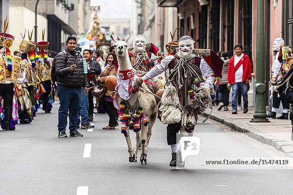 Procession of the Virgen del Carmen of Paucartambo (Cusco) characters and typical costumes. Peru South America.