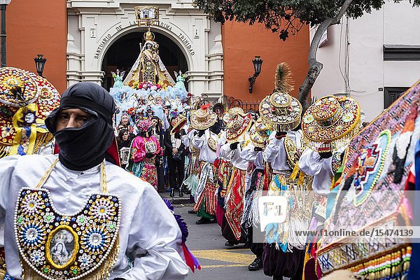 Procession of the Virgen del Carmen of Paucartambo (Cusco) characters and typical costumes. Peru South America.