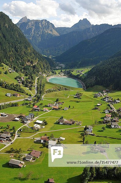 Austria: Paragliding above the village St. Gallenkirchen in the Zillertal Valley in Tirol's mountains.