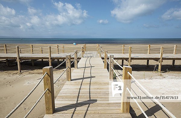 Wooden footbridges at the beach of Riumar. Environs of the Ebro Delta Nature Reserve Tarragona province Catalonia Spain.