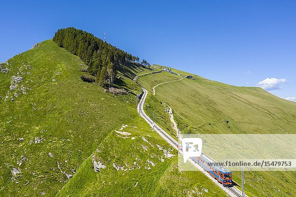 Aerial view of the Monte Generoso rack railway and train. Rovio Lake Ceresio Canton Ticino Switzerland.