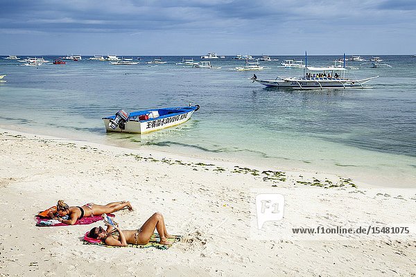 Young Women Sunbathing On Alona Beach  Bohol  The Philippines.