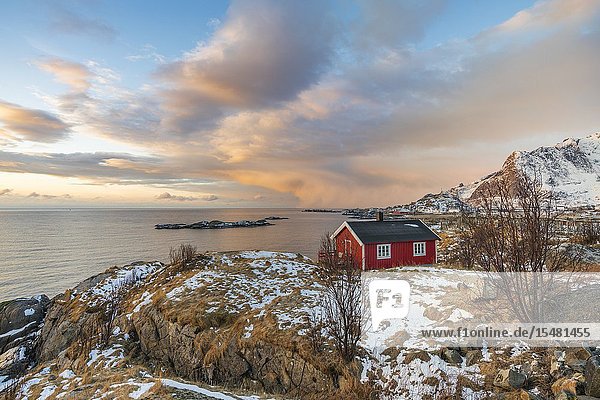 Traditional fishermen house in winter at dawn. Hamnoy Nordland county Northern Norway Norway.