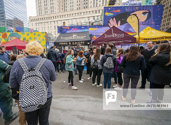 Tourists and workers in Downtown Manhattan flock to the latest iteration of the popular Smorgasburg located outside the Oculus on opening day Friday August 12 2019. The marketplace features prepared and artisanal foods by small entrepreneurs. After a one-day trial run last year the popular food court will open every Friday to feed the hungry masses in Lower Manhattan until at least October. (© Richard B. Levine).