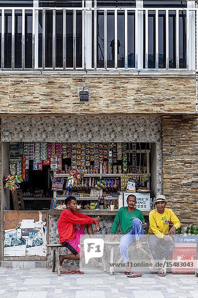 Three Filipinos Sitting Outside A Shop Boracay Aklan Province The Philippines.